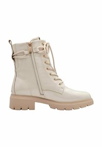 White, textured leather ankle boots with a lace-up front, side zipper, and chunky beige rubber sole. Features gold hardware accents.