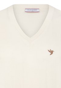 Kreemivärvi V-kaelusega sviiter pehme kudumitekstuuriga. Vasakul küljel on väikene pruun tikandiga kolibri. Suurus M.