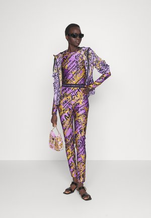 SHINY SUMATRA - Leggings - gold/iris