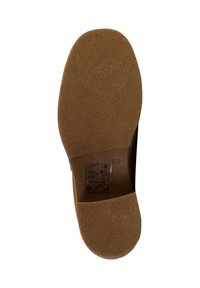 Semelle de chaussure en caoutchouc brun avec surface texturée, forme arrondie et support de voûte plantaire moulé. Inclut des étiquettes et symboles d'entretien sur le côté.