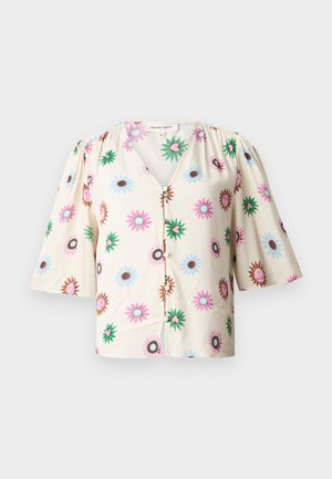 Blütenbluse aus cremefarbenem Stoff mit Puffärmeln, V-Ausschnitt und Knopfverschluss. Das Design umfasst bunte Blumen in verschiedenen Größen.