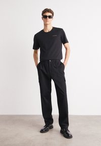 Calvin Klein Jeans REGULAR STRAIGHT  - Kapsáče - black