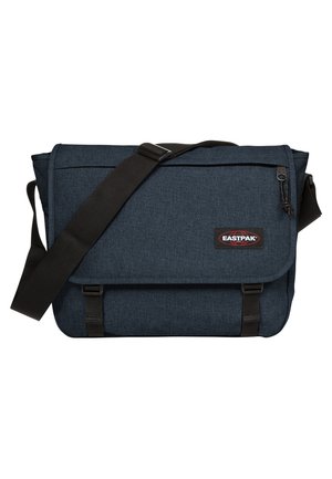 Dark blue messenger bag made from textured fabric, featuring an adjustable strap, flap closure, and Eastpak logo patch on the front.