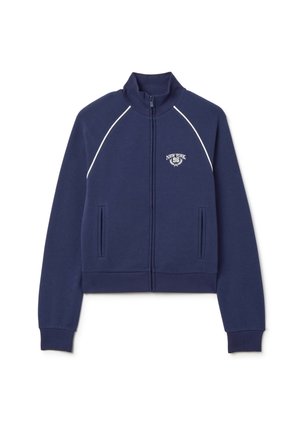 Sudadera con cremallera de color azul marino, con alto cuello, detalles en blanco, bolsillos frontales y logo bordado "New York 96" en el pecho.