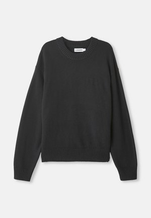 Black knitted sweater with a round neckline, ribbed cuffs and hem, featuring a subtle textured logo on the front left.