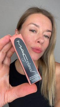 MATTE LIPSTICK in a rectangular pink and black box, featuring bold white text. The product is held between the thumb and forefinger.