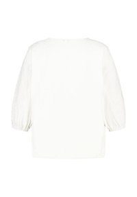Weiße Bluse mit Ballonärmeln, aus strukturiertem Stoff, mit rundem Kragen und lässiger Passform, glatte Oberfläche auf der Rückseite.