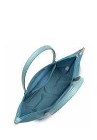 Türkise Lederhandtasche mit Reißverschluss und zwei Griffen. Das Innere verfügt über ein glattes Stofffutter und eine kleine Tasche.