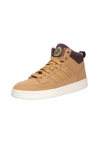 Beżowe sneakersy wysokie z gładkiej skóry, z teksturowanymi akcentami i ciemno-brązowym kołnierzem. Posiadają wyściełany język i naszywkę z logo.