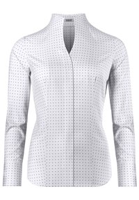 Witte blouse met lange mouwen en marineblauwe stippen, voorzien van een opstaand kraagje en een slanke pasvorm met subtiele zijnaadjes.