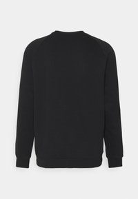 Pull noir à manches longues, avec des poignets et un col côtelés. Texture lisse et design simple, vu de dos.