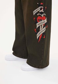 Ed Hardy DEATH BEFORE DISHONOR XTRA  - Flared jeans - black