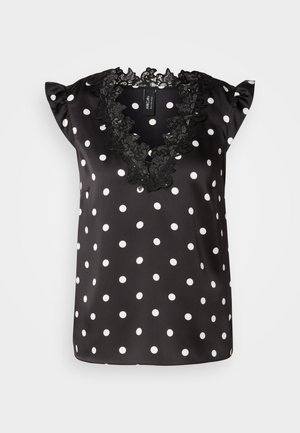 Black polka dot blouse with white dots, features short ruffled sleeves and a scalloped black lace neckline. Smooth satin material.