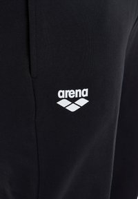 Arena UNISEX - Jogginghose - schwarz