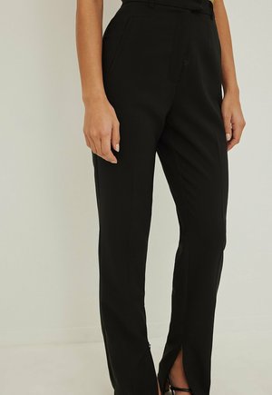 Spodnie materiałowe