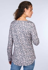 Graues Langarmshirt mit floralem Muster in Hellrosa. Runder Ausschnitt, leicht geschwungener Saum und weicher Stofftextur.