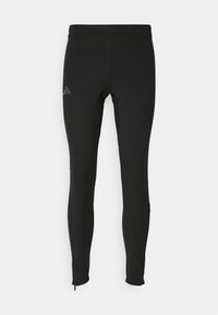 Czarne legginsy sportowe o gładkiej teksturze, z elastycznym pasem, zwężanym krojem i małym szarym logo na lewej udzie.