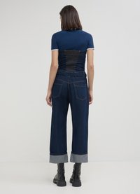 Calliope CON RISVOLTO - Tuta jumpsuit - blu