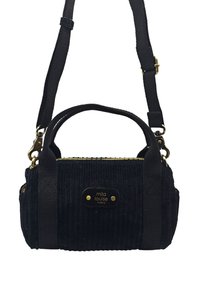 Sac à main en velours côtelé noir avec deux courtes poignées et une bandoulière amovible et réglable. Détail de fermeture éclair dorée et plaque logo.