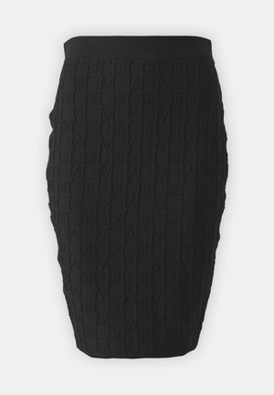 Čierna ceruzková sukňa s textúrovanou tkaninou s prepleteným vzorom. Jednoduchý pás, strih na mieru a dĺžka po kolená.