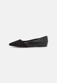 Black pointed-toe flats featuring a suede front and leather back, with a sleek design and no visible hardware or accents.
