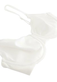 Hvid formet bh med glat stof, justerbare stropper og sømløs design. Har en kroglukning bagpå og blød tekstur.