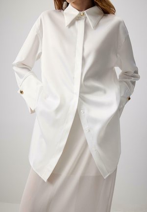 Bluza z gumbi - beyaz