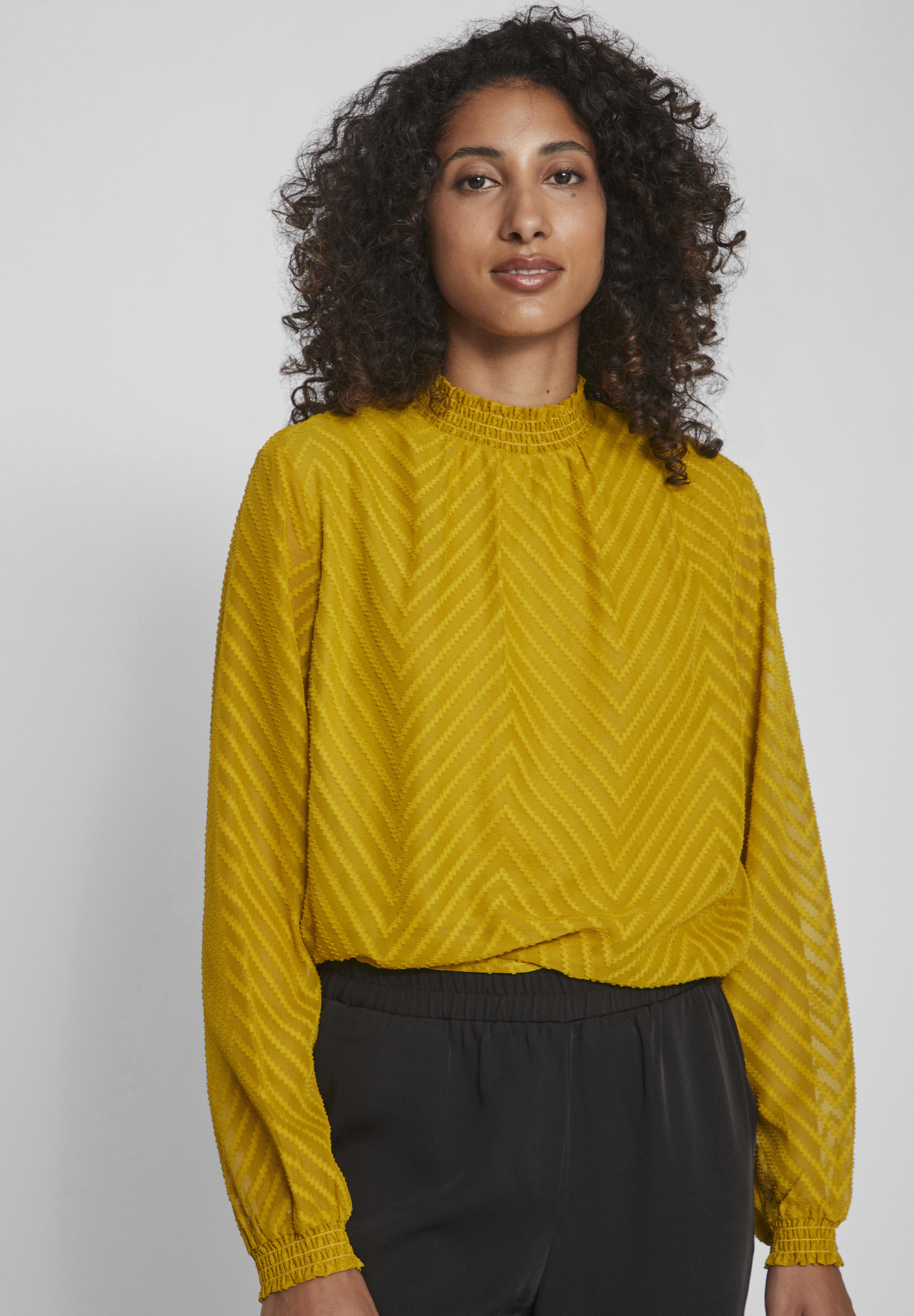 yellow high neck blouse