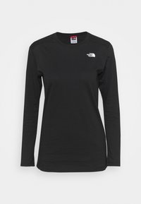 Schwarzes Langarmshirt aus glattem Stoff, mit Rundhalsausschnitt und einem kleinen weißen Logo auf der Brust. Leicht und körperbetont geschnitten.