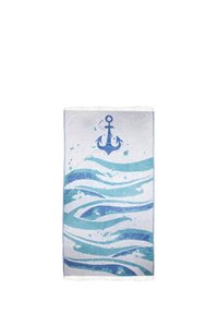 Blue and white beach towel featuring an anchor design and wave patterns, textured fabric, and fringe edges.