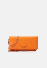 Orange leather clutch bag with a silver chain strap. Features decorative wing design and zip closure at the bottom. Smooth texture.