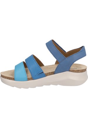 Blue sandal featuring multiple straps in varying shades, a textured cork footbed, and a white wedge sole for comfort and support.