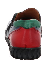Multicolor leather shoe with a black rubber sole. Features red, blue, and green accents. Rounded shape, smooth texture, and low-cut design.