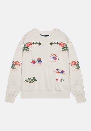 Knitted cream sweater featuring a winter scene with trees, houses, and figures in colorful attire. Ribbed cuffs and hem for added detail.