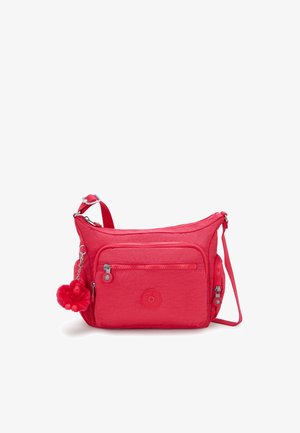 Borsa a tracolla in tessuto trapuntato rosso con tasca frontale con zip, tracolla regolabile e un charm a forma di scimmia rossa pelosa. Logo circolare impresso nella parte inferiore.