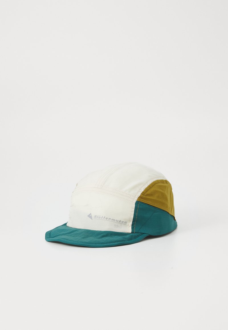 Multi-colored cap featuring a cream top, green brim, and mustard side panels. Made from lightweight fabric with a smooth texture and stitched details.