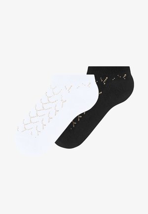 Pair of low-cut ankle socks, one white and one black, each with a dotted chevron pattern along the sides.