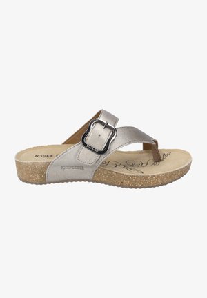 Silver leather sandal with a wide strap, adjustable metal buckle, and a cushioned insole. Cork sole with a textured finish.