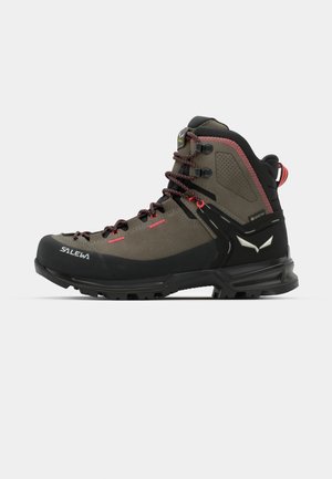 Brown and black hiking boot with a high ankle design, textured upper, red laces, and a rugged sole. Features a logo and waterproof material.