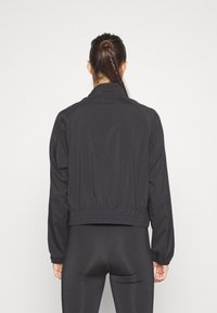 Puma Verryttelytakki - black