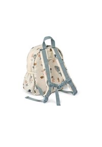 Zaino per bambini di colore crema con motivi a tema oceanico. Dotato di spallacci blu regolabili, chiusura con zip e una piccola tasca frontale.