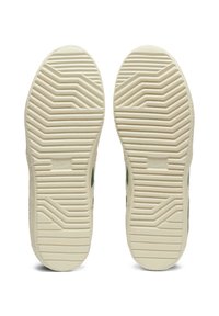 Sneaker zool met een gestructureerd, beige rubberontwerp, gekenmerkt door een zigzagpatroon voor grip en een logo dat nabij het midden is opgedrukt.