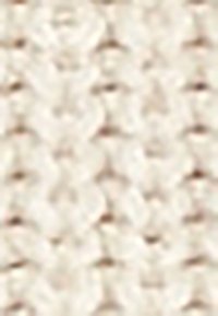 Gros plan flou d'une surface texturée avec de petites formes rondes répétées dans des tons beige et marron.