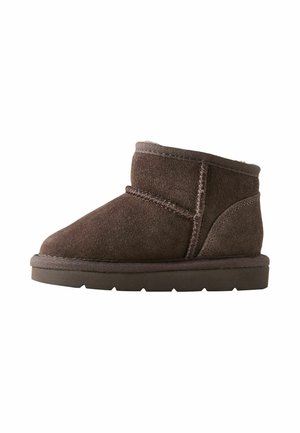Brown suede ankle boot with thick sole and visible stitching, designed for warmth and comfort.