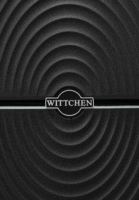 Black textured surface with concentric wave pattern. Features a circular silver logo with "WITTCHEN" and a black stripe.