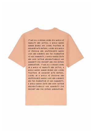 Peach cotton t-shirt featuring short sleeves. The back displays black, bold text with a motivational message about equality and community values.