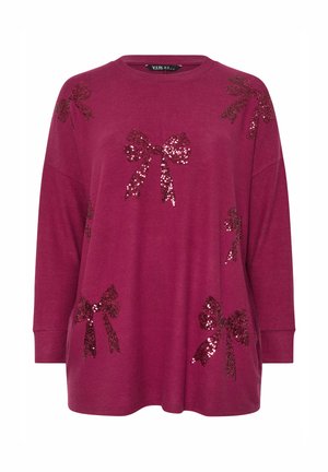 Bordowy top z długim rękawem i okrągłym dekoltem, ozdobiony wieloma kokardkami wyszywanymi cekinami w różnych rozmiarach na przodzie. Miękki, teksturowany materiał.