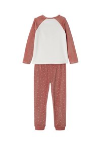 Baumwoll-Pyjama-Set mit einem weißen Langarmoberteil und weichen, leicht rötlich-pinken Hosen mit kleinen weißen Punkten. Mit rundem Ausschnitt und gerippten Bündchen.
