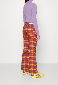 The Ragged Priest Jean flare - multi-coloured