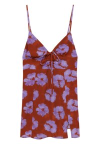 Blumen-Camisole in Rostrot mit großem lila Blumenmuster, ausgestattet mit dünnen, verstellbaren Trägern und einer Schleifendetail vorne.